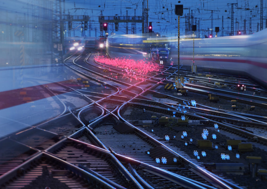 Gleisanlagen und Zugverkehr bei Nacht